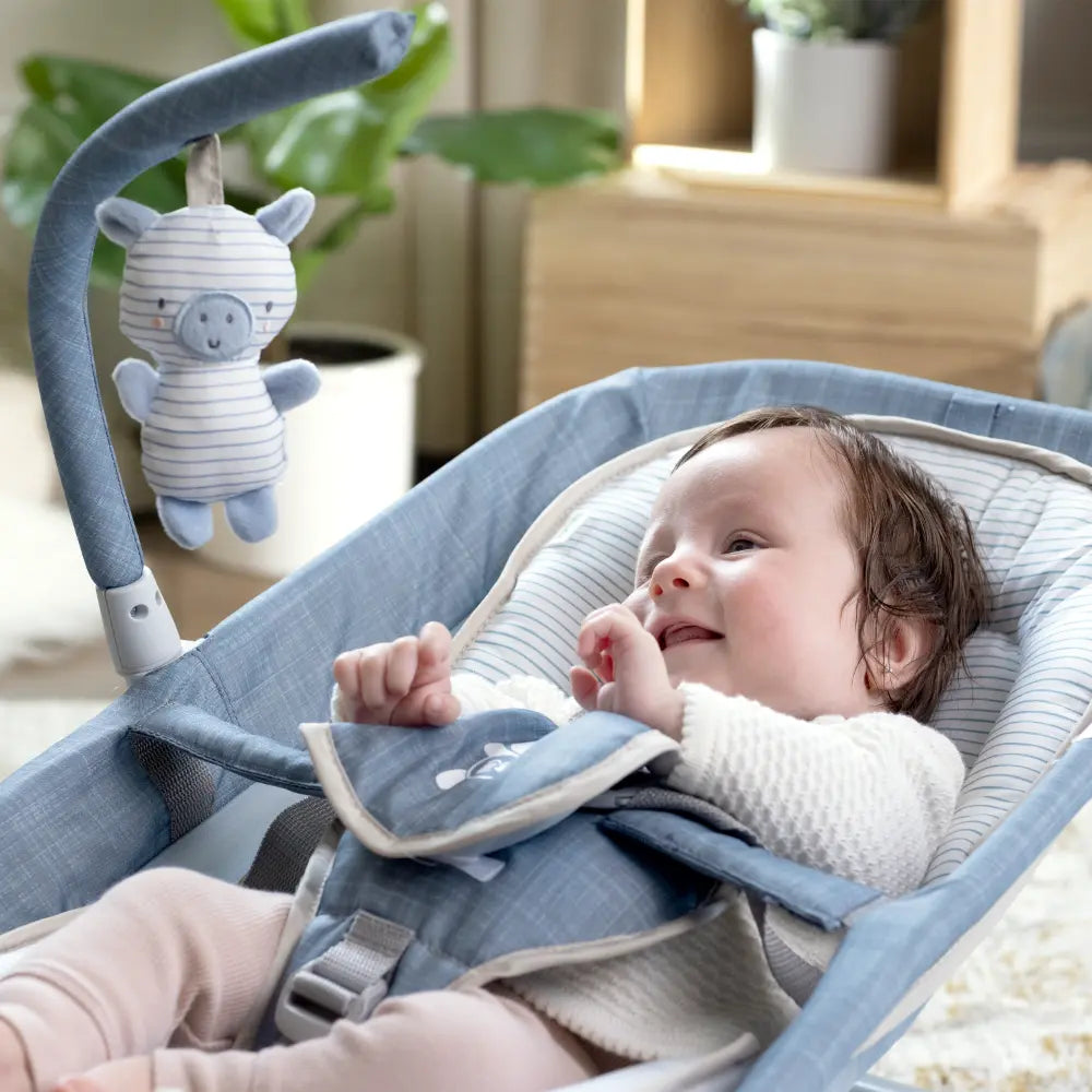 Ingenuity Happy Belly Rock-to-Bounce Baby Massage Seat with Soothing Vibrations, Music &amp; Belly Massage Technology, 0-6 months,  Chambray