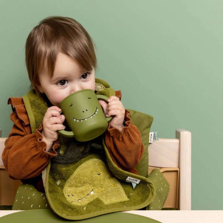 Trixie Silicone Sippy Cup | 100% Food-Grade Silicone Spill-Resistant Training Cup with Easy-Grip Handles for Independent Drinking | 4 Months Onwards | Mr. Dino