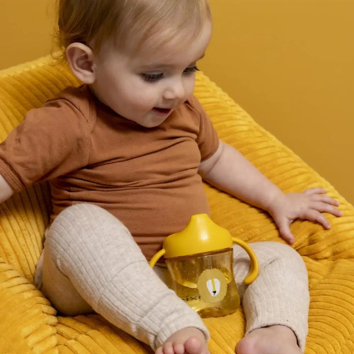 Trixie Sippy Cup with Handles | Spill-Resistant Tritan™ Training Cup with Easy-Grip Handles for Independent Drinking | 4 Months Onwards | Mr. Lion