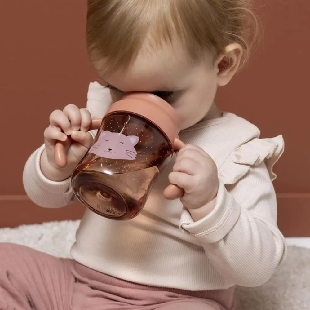 Trixie Sippy Cup with Handles | Spill-Resistant Tritan™ Training Cup with Easy-Grip Handles for Independent Drinking | 4 Months Onwards | Mrs. Cat