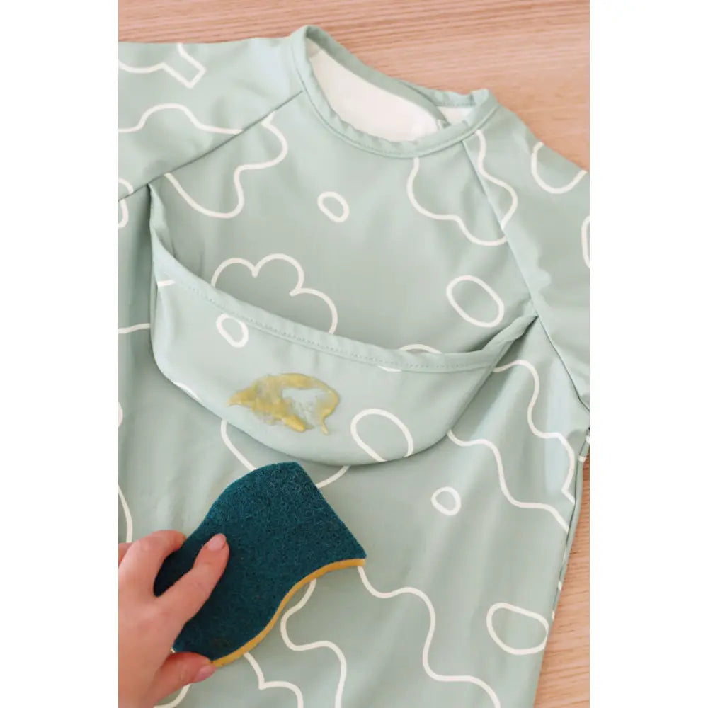 Beaba 2-in-1 Waterproof Bib with Detachable Sleeves, Foldable Food Catcher Pocket, Adjustable Snap Fit &amp; Elastic Cuffs, Soft &amp; Easy-Clean Bib for Feeding &amp; Activities, 4M+