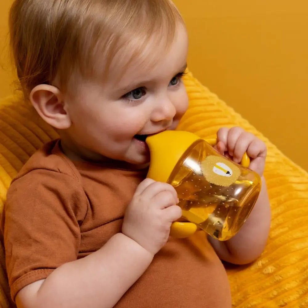 Trixie Sippy Cup with Handles | Spill-Resistant Tritan™ Training Cup with Easy-Grip Handles for Independent Drinking | 4 Months Onwards | Mr. Lion
