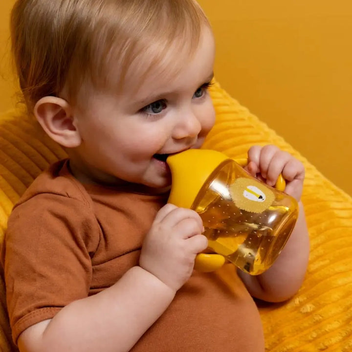 Trixie Sippy Cup with Handles | Spill-Resistant Tritan™ Training Cup with Easy-Grip Handles for Independent Drinking | 4 Months Onwards | Mr. Lion
