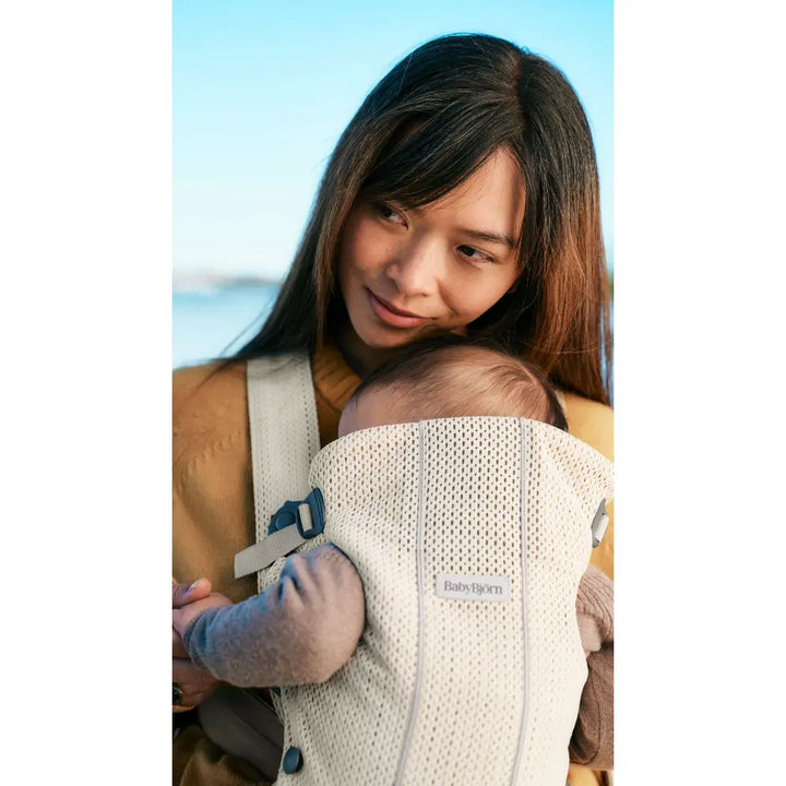 BabyBjorn Mini Baby Carrier, Soft &amp; Lightweight Mesh Fabric, 3 Carrying Positions, Ergonomic Hip and Head Support, Adjustable Waistbelt &amp; Cross Straps, Easy to Use, Birth to 12 Months (upto 11kg) - Cream
