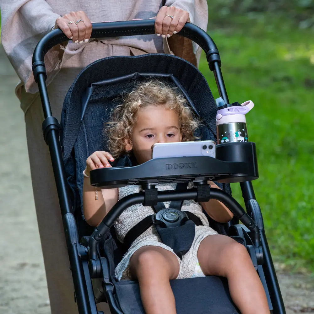 Dooky Stroller Snack Tray with Cup Holder &amp; Phone Holder, Universal Baby Stroller Activity Tray, Food &amp; Toy Organizer for Kids Travel - (Black)