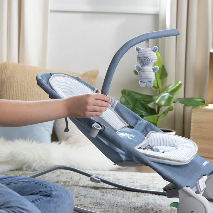 Ingenuity Happy Belly Rock-to-Bounce Baby Massage Seat with Soothing Vibrations, Music &amp; Belly Massage Technology, 0-6 months,  Chambray