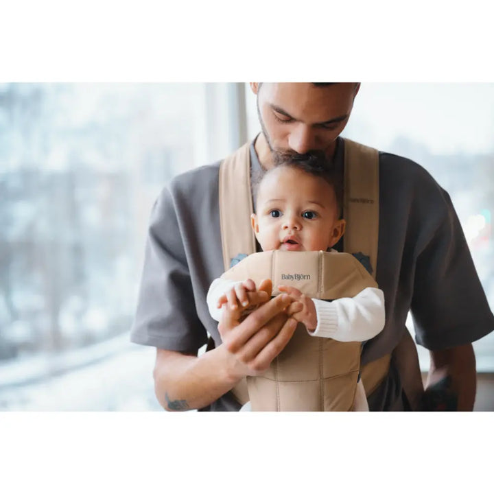 BabyBjorn Mini Baby Carrier, Soft &amp; Lightweight Fabric, 3 Carrying Positions, Ergonomic Hip and Head Support, Adjustable Waistbelt &amp; Cross Straps, Easy to Use, Birth to 12 Months (upto 11kg) - Beige