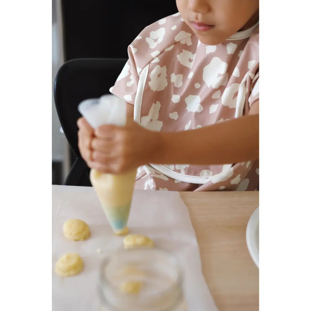 Beaba 2-in-1 Waterproof Bib with Detachable Sleeves, Foldable Food Catcher Pocket, Adjustable Snap Fit &amp; Elastic Cuffs, Soft &amp; Easy-Clean Bib for Feeding &amp; Activities, 4M+