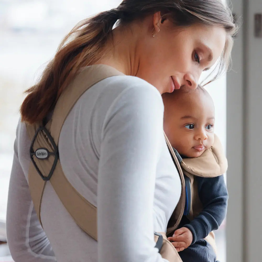 BabyBjorn Mini Baby Carrier, Soft &amp; Lightweight Fabric, 3 Carrying Positions, Ergonomic Hip and Head Support, Adjustable Waistbelt &amp; Cross Straps, Easy to Use, Birth to 12 Months (upto 11kg) - Beige