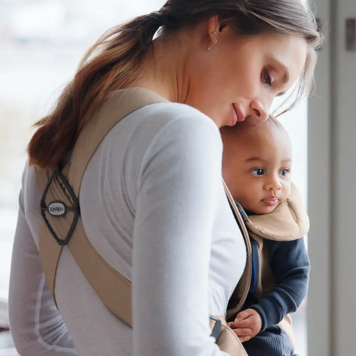 BabyBjorn Mini Baby Carrier, Soft &amp; Lightweight Fabric, 3 Carrying Positions, Ergonomic Hip and Head Support, Adjustable Waistbelt &amp; Cross Straps, Easy to Use, Birth to 12 Months (upto 11kg) - Beige