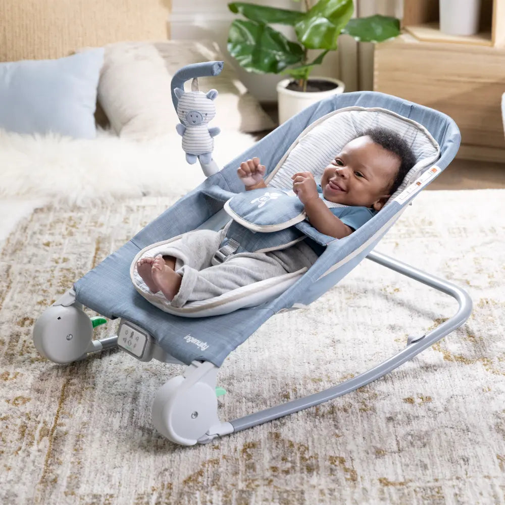 Ingenuity Happy Belly Rock-to-Bounce Baby Massage Seat with Soothing Vibrations, Music &amp; Belly Massage Technology, 0-6 months,  Chambray
