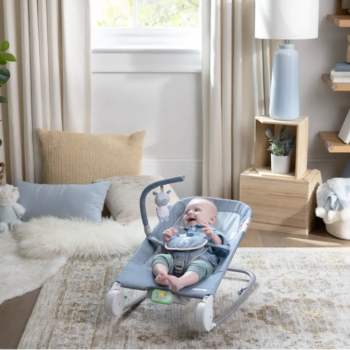 Ingenuity Happy Belly Rock-to-Bounce Baby Massage Seat with Soothing Vibrations, Music &amp; Belly Massage Technology, 0-6 months,  Chambray